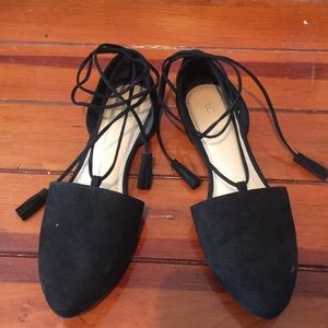 Black lace up flats.